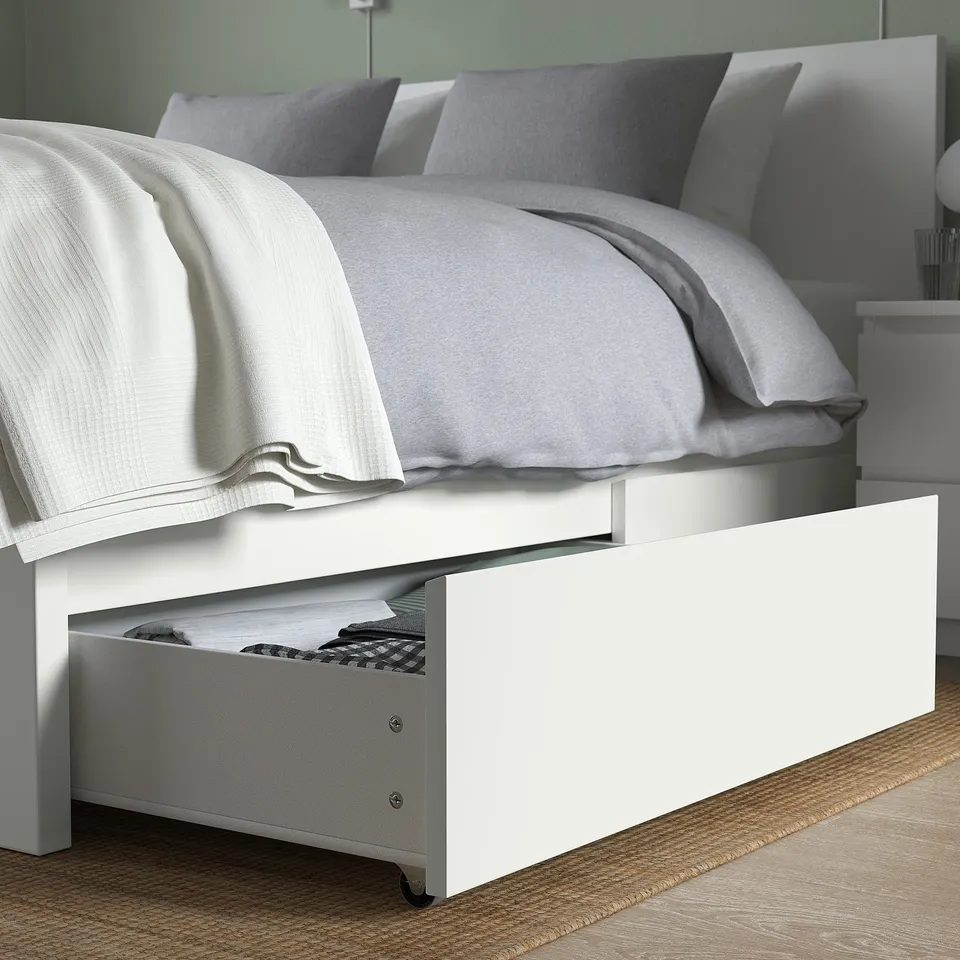 Bed with large under-drawer storage, smooth-rolling castors.