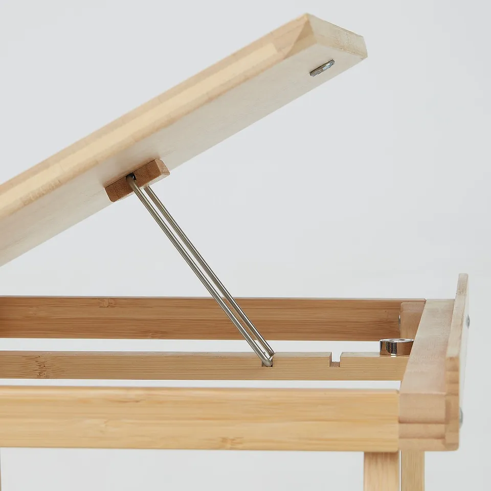 Close-up of FELFRITT laptop stands sturdy bamboo hinge and metal support.