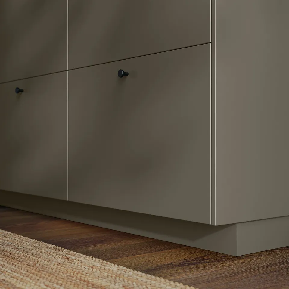 Modern grey HAVSTORP cabinet set with sleek, straight lines and smooth surfaces, including plinth for uniform look.