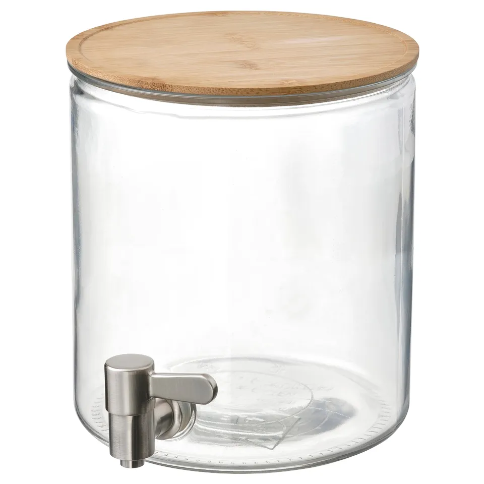 IKEA 365+ glass drink dispenser, bamboo lid, stainless steel tap, clear, cylindrical, simple design.