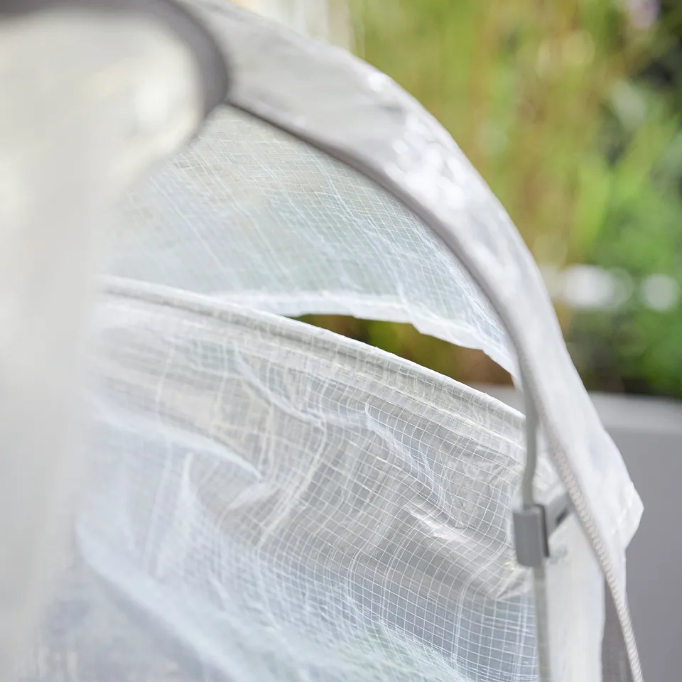 White ASPAREN plant cover, greenhouse-style design, protective mesh material.