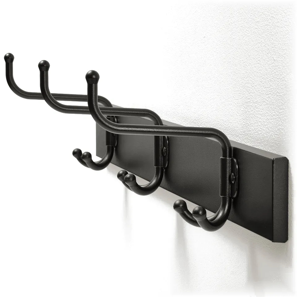 Black wall-mounted coat rack with three hooks; sleek and sturdy design.