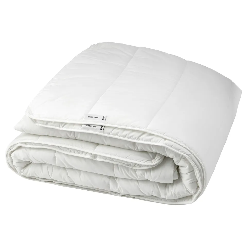Ikea SMÅSPORRE white comforter, folded, rectangle with box stitching.