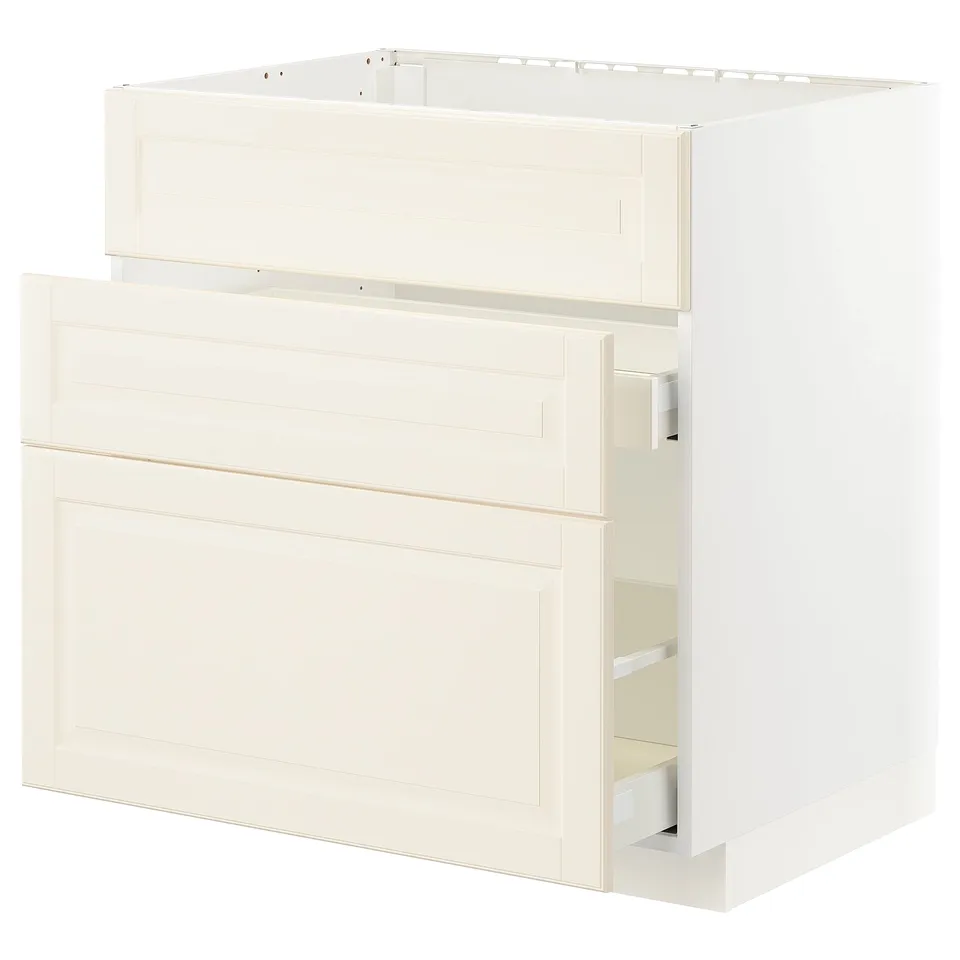 An off-white METOD kitchen cabinet with bevelled edges, featuring a structured design and smooth-running drawers.