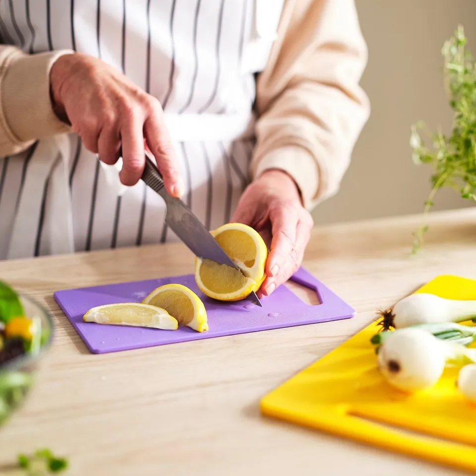 BERGTUNGA Chopping board, set of 2, bright yellow/lilac