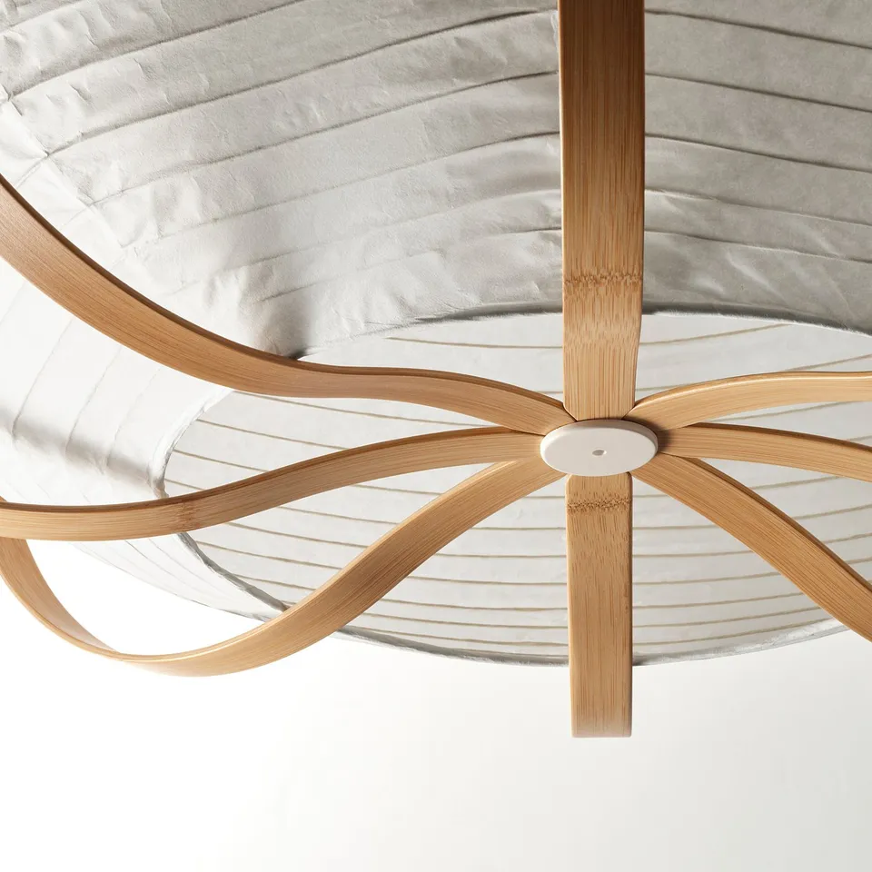 Modern pendant lamp with bamboo and rice paper shade, suspended from a central white holder.
