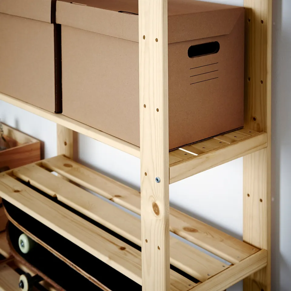 Wooden storage shelves with cardboard boxes. Sturdy, adjustable, and suitable for heavy loads.