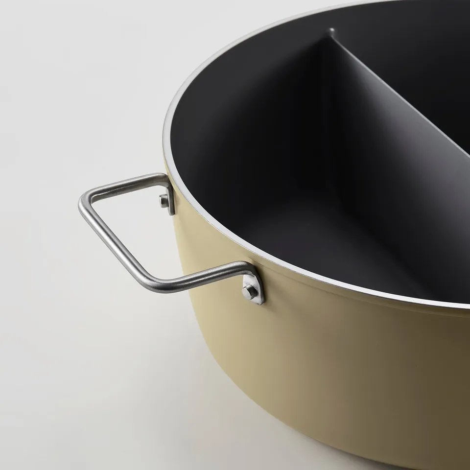 Close-up of a high-quality pot with secure handles and non-stick coating.