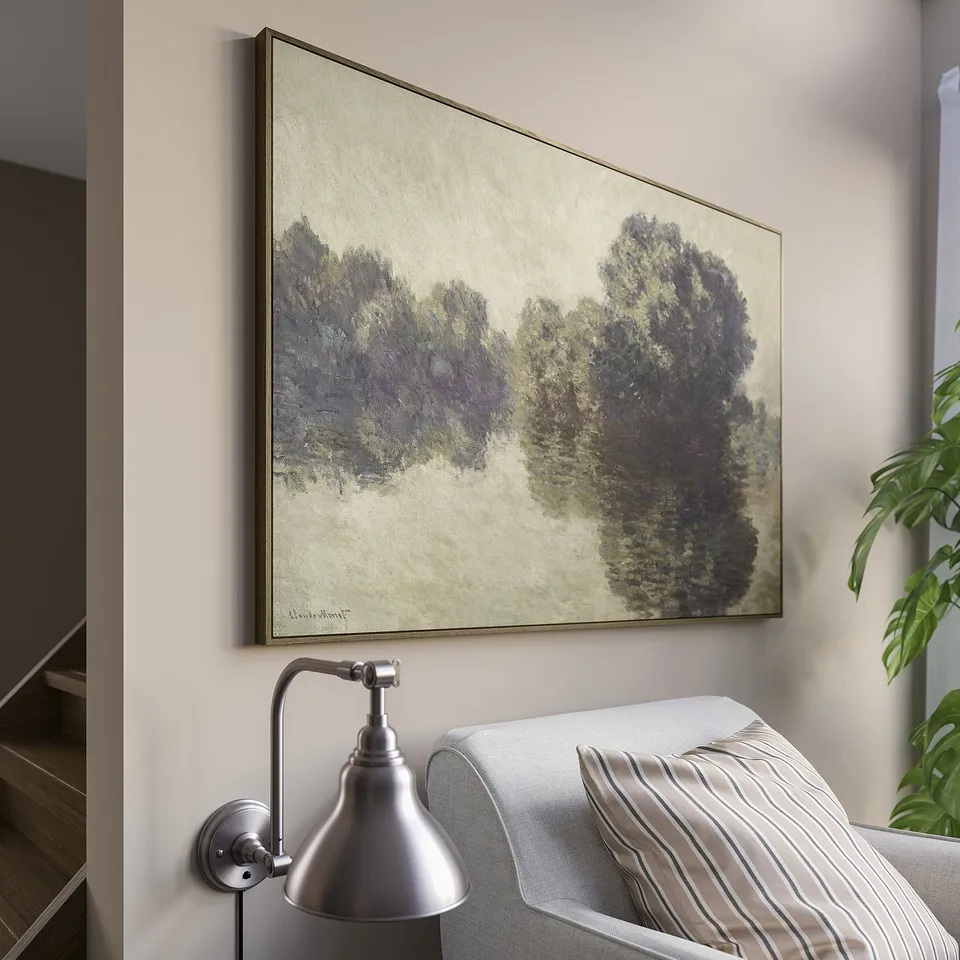 BLODFLÄDER monet print on light wall, above grey chair & striped pillows, contrasting modern furniture.