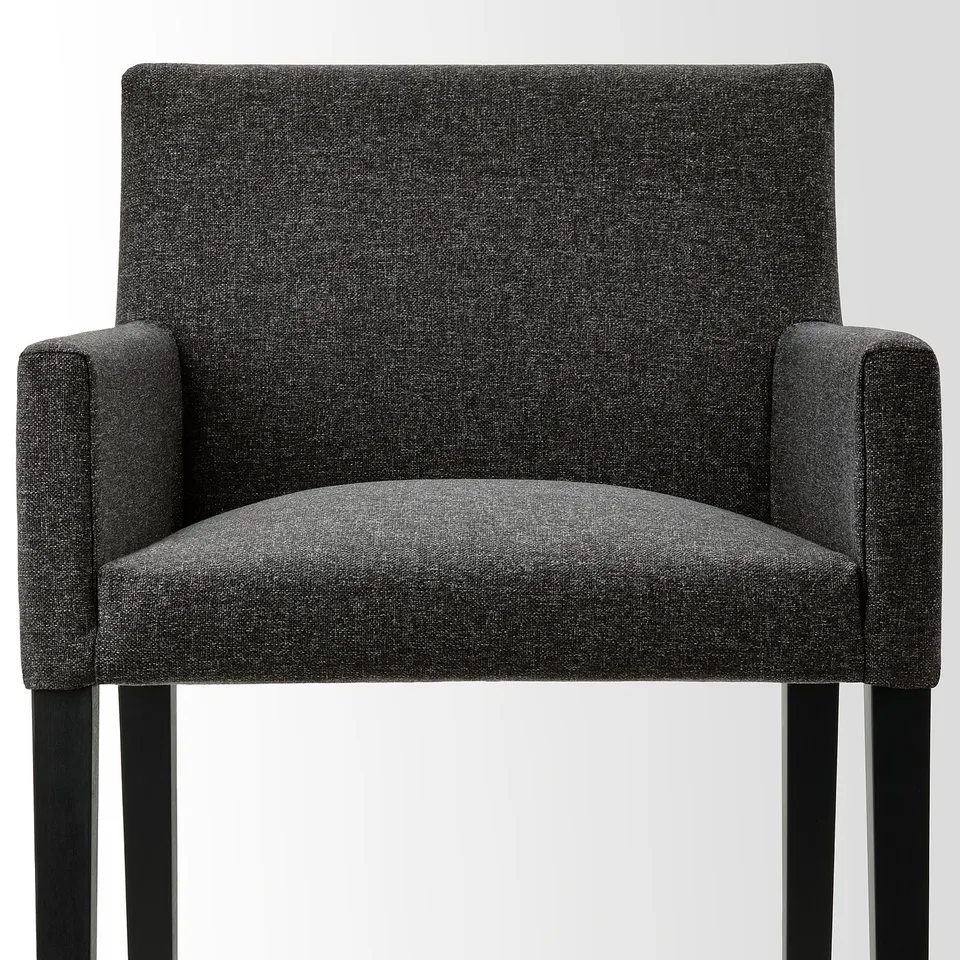 A sleek, modern chair with a grey fabric cover and sturdy wooden legs, designed for comfort and durability.