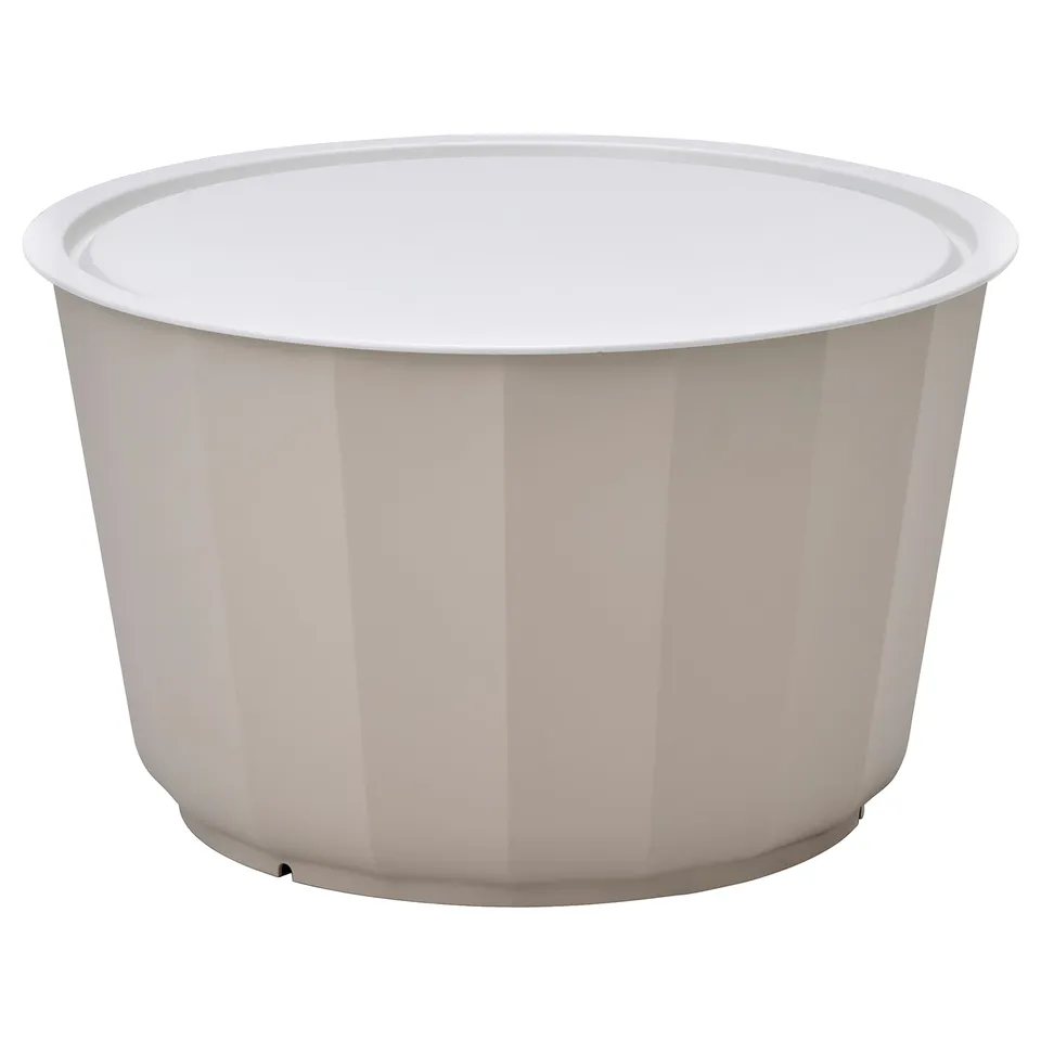 A round, white LÅGASKÄR coffee table with vertical lines and a removable tray, ideal for outdoor use.