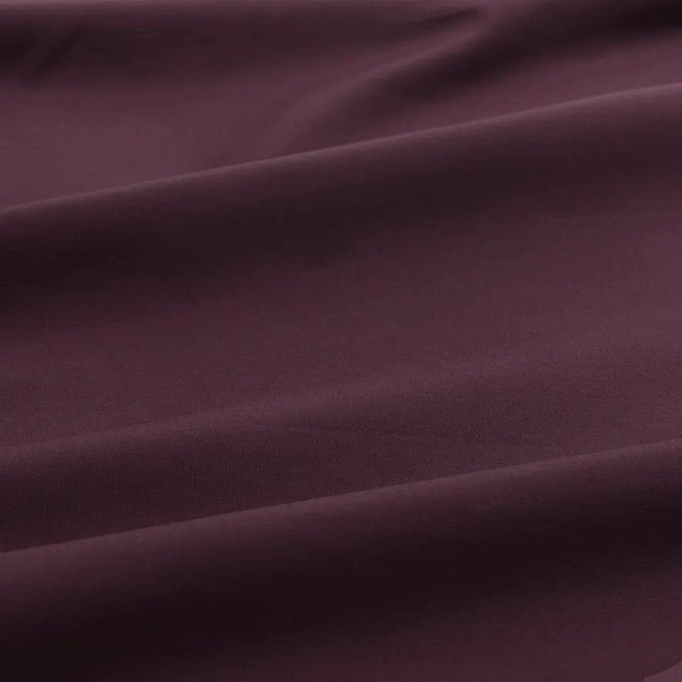 Close-up of smooth, crisp pillowcase showcasing tight weave, fine texture, and soft fabric quality.