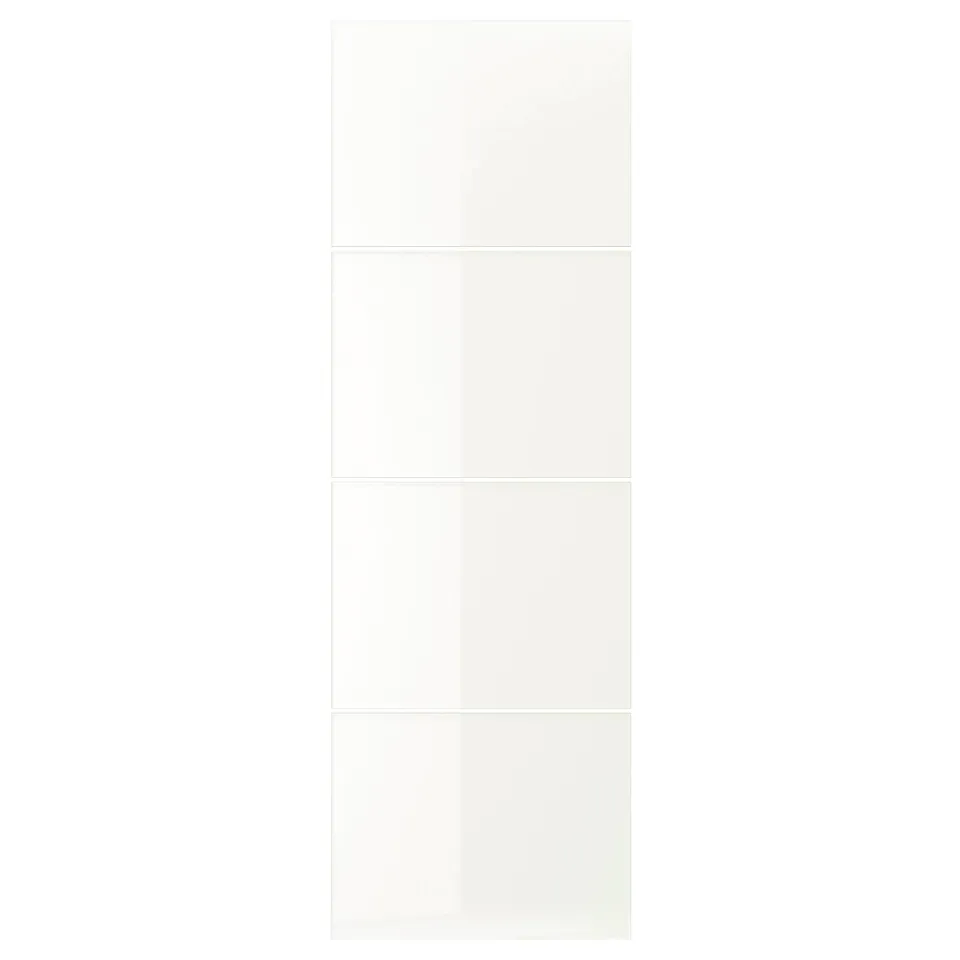 A FÄRVIK wardrobe with white glass panels. These sleek, reflective surfaces enhance space and light. The modern design uses glass enamel.