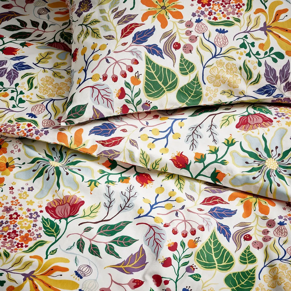 Vibrant flower-patterned cotton duvet set, textured with slubbed yarn for a casual, tactile feel.