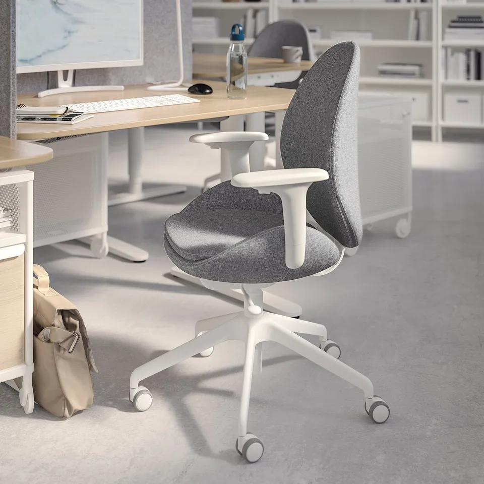 Modern office chair hattenfjäll in grey and white, ergonomic with adjustable on wheels, placed in a minimalist workplace.