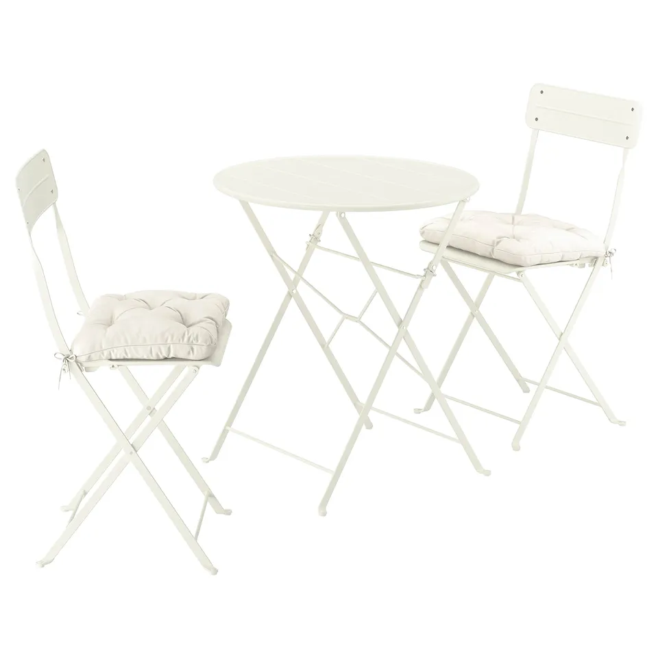 Easy-fold white metal patio set includes round table and two chairs with beige cushions.