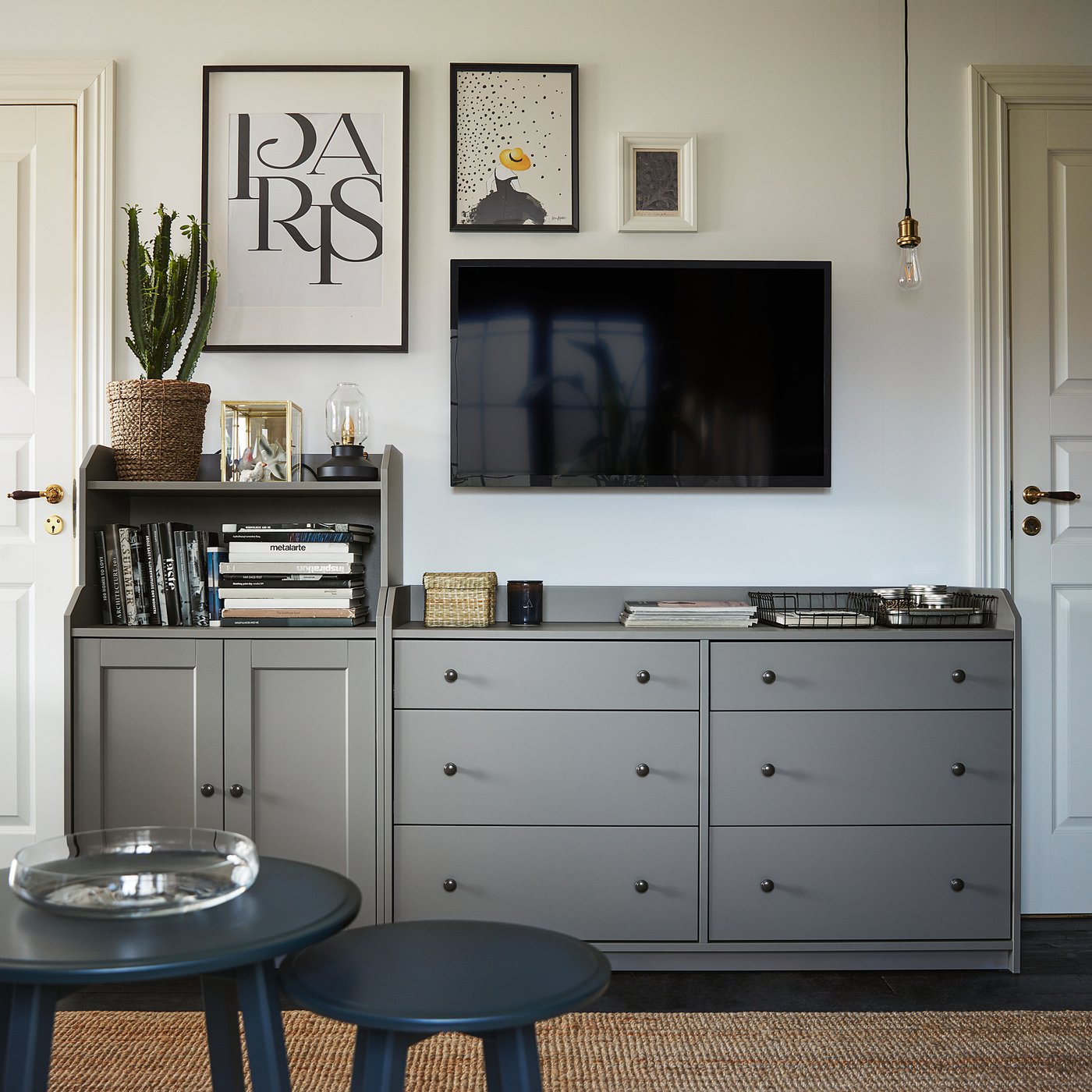 Stylish grey living room featuring HAUGA storage unit with tv and decor.