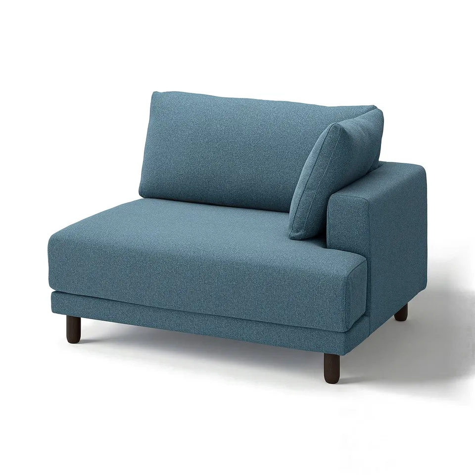 A blue fabric UPPÅKRA 1. 5-seat sofa module with wooden legs. It a modern, clean design with oversized cushions.