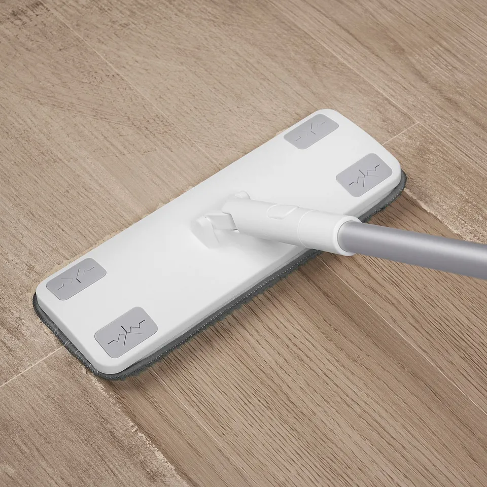 White PEPPRIG mop on wooden floor, adjustable handle, flat mop head at base.