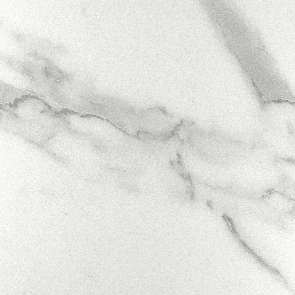 White laminate surface, delicate veining, polished, quality edges.