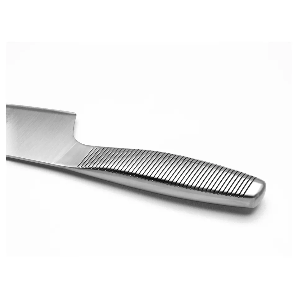 Stainless steel knife with grooved handle, designed for durability and sharpness.