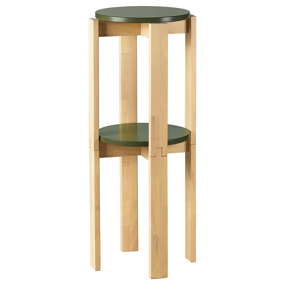 KOMPISHÄNG stool. Light wood with green seat. Round, stackable design. Ideal for space-saving.