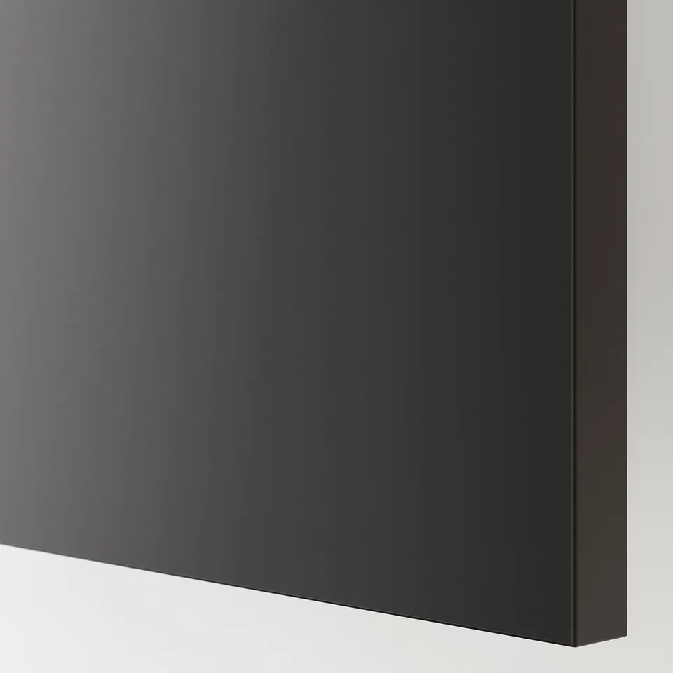 Close-up: matt black kitchen cabinet, smooth finish, clean edges, modern look.