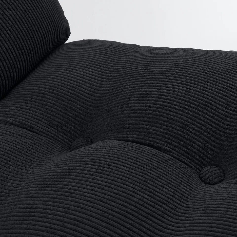 Close-up of soft, textured black fabric on a modern chair, showcasing its high-quality, ribbed design.