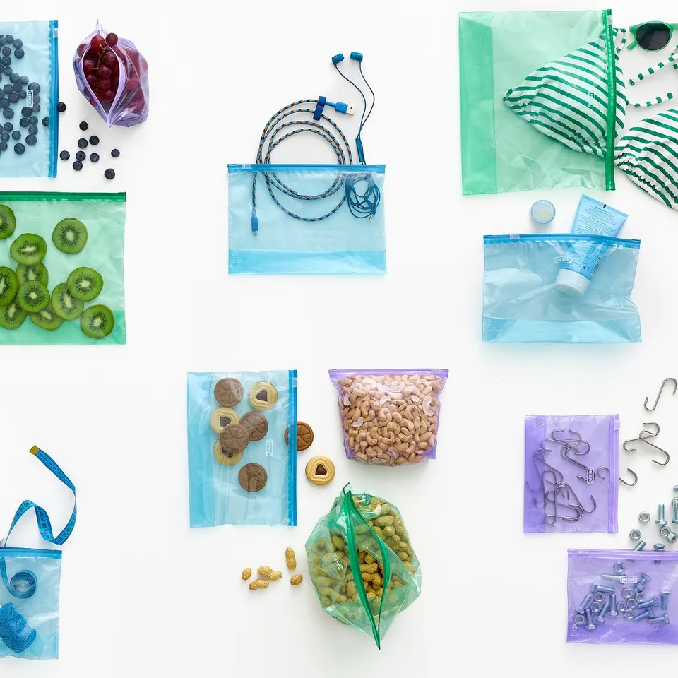 Various coloured resealable bags containing fruits, snacks, electronics, and hardware, showcasing organisational and storage capabilities.