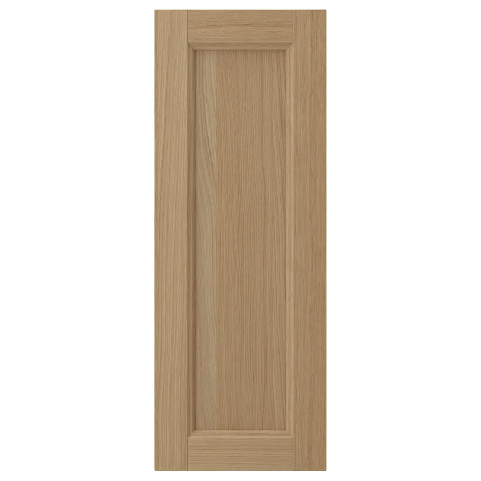 VEDHAMN natural wood cabinet door. Rectangle shape with grooved panel. Crafted from oak, finished with clear lacquer.