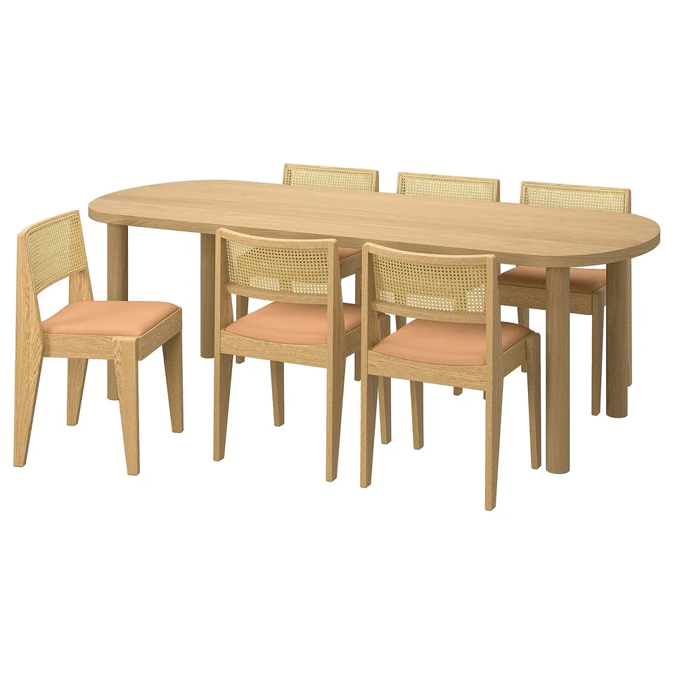Modern oval dining table and chairs with light wood finish and orange cushions, perfect for elegant and comfortable dining.