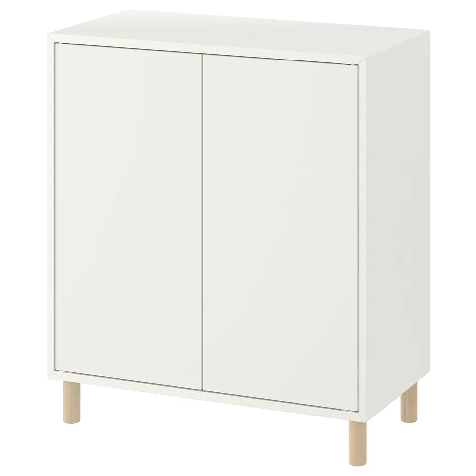 White EKET storage cabinet, rectangular shape, two doors, wooden legs.