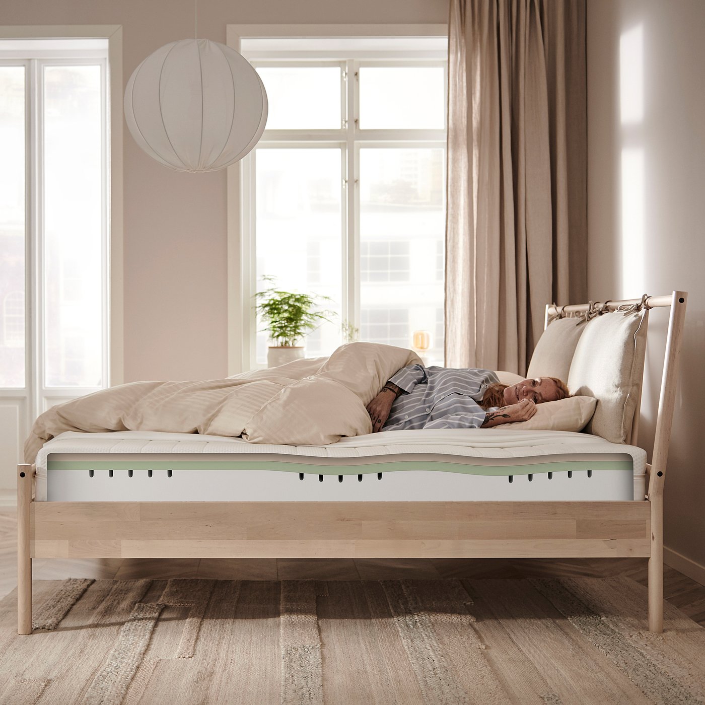 Serene bedroom with NORDLI bed, natural light.