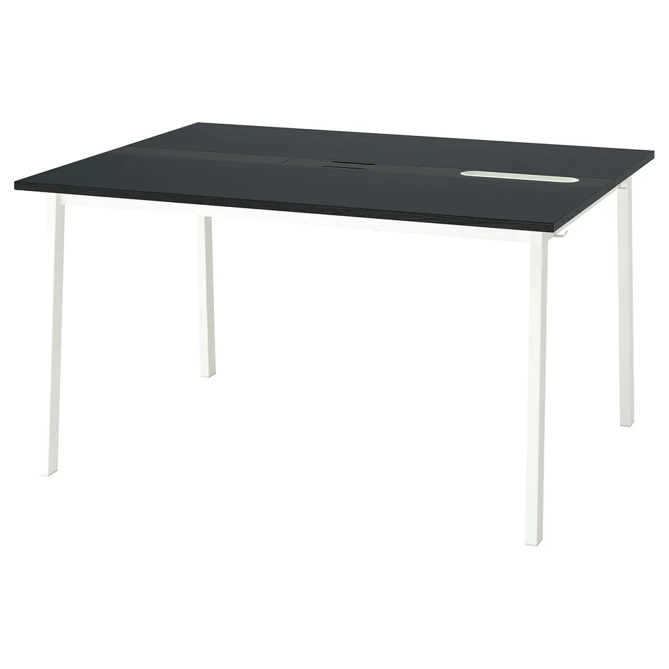 A modern MITTZON conference table with a black top and white legs.