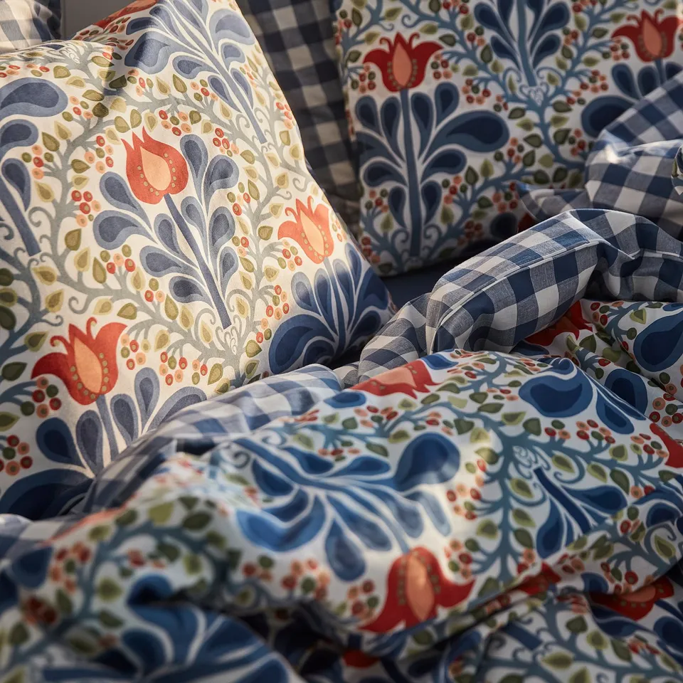 Floral quilt pile, soft & detailed, intricate design, cosy & breathable, recycled materials.