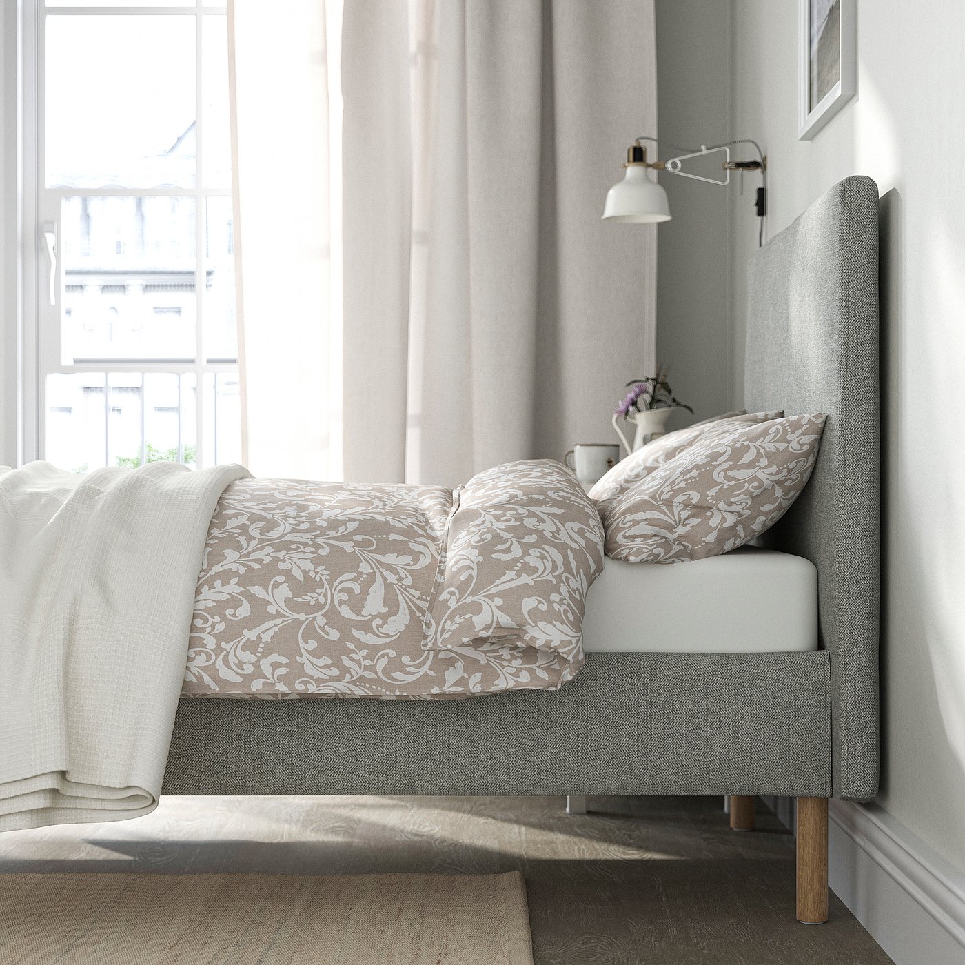 Bed with cushioned headboard, removable washable cover, and slatted base for air circulation.