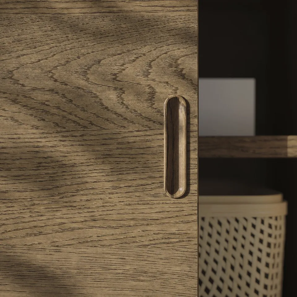 Close-up of elegant wooden cabinet with sleek handle, showcasing quality veneer texture and design.
