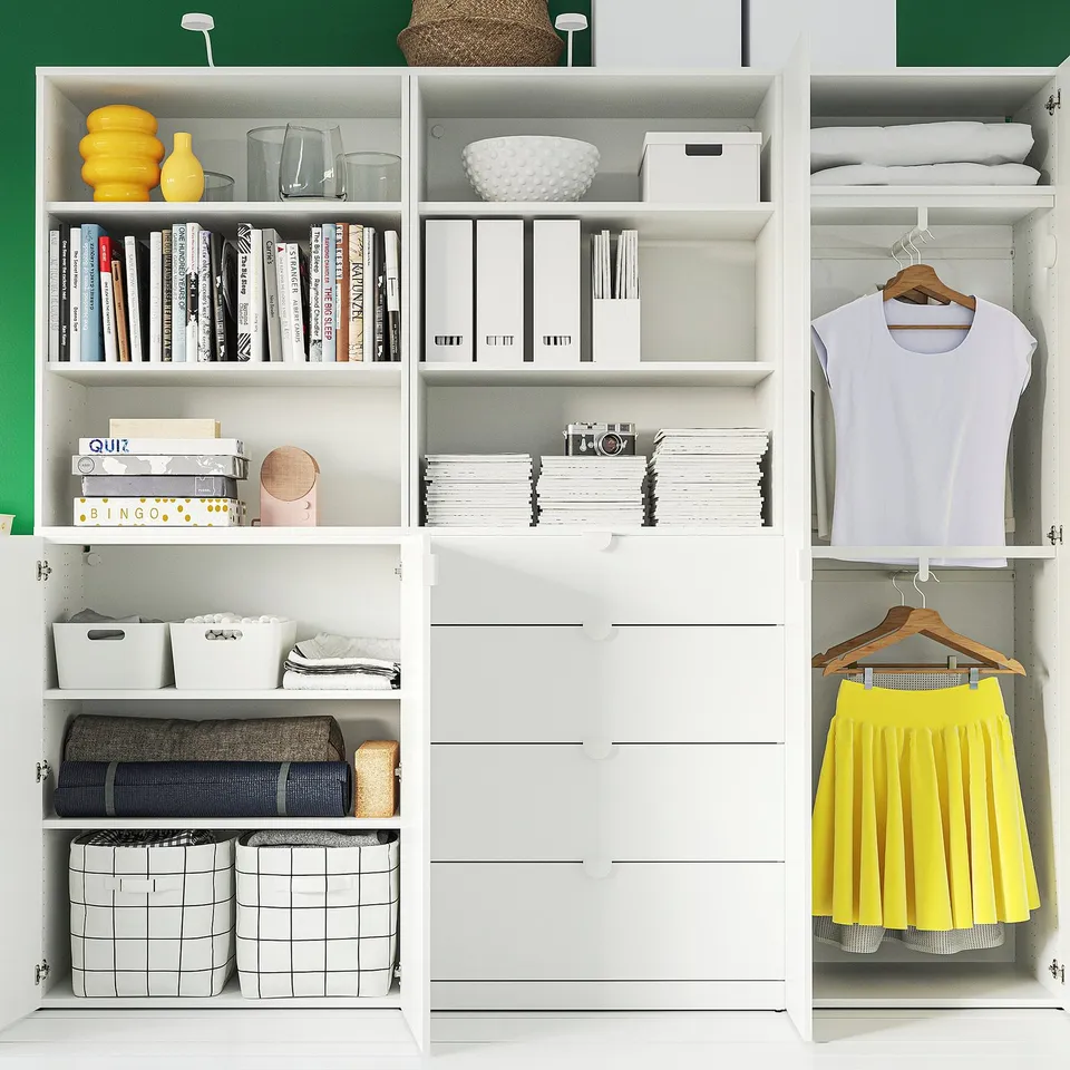 Closet and shelves: books, clothes, boxes, and decorations neatly organised. Wardrobe with drawers and hanging space.
