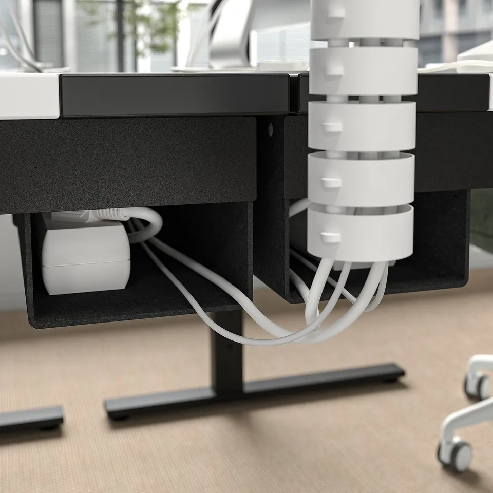 Cable management tray under MITTZON adjustable desk, keeping cords organised and workspace tidy.