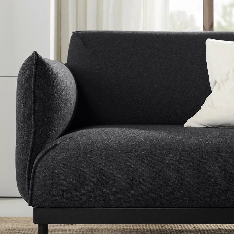 Modern dark grey ÄPPLARYD sofa, sleek design with slim black legs, comfy cushions.