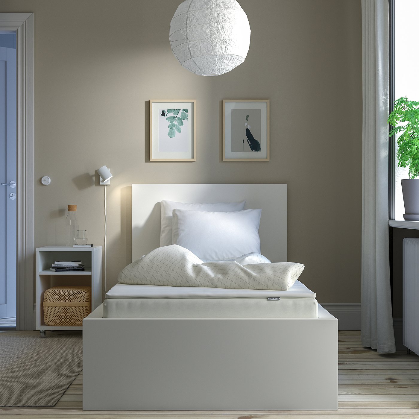 Modern bedroom with NOPAKTE foam mattress, white decor, minimalist design.