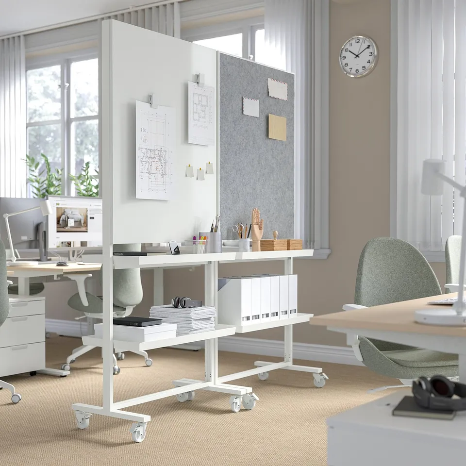 Modern office with mobile storage, papers, books, and supplies.