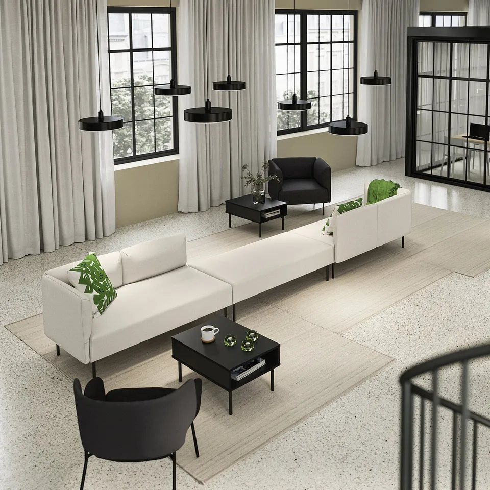 Modern living area with LILLEHEM white modular sofas, black coffee tables, black pendant lamps, and large windows with white curtains.