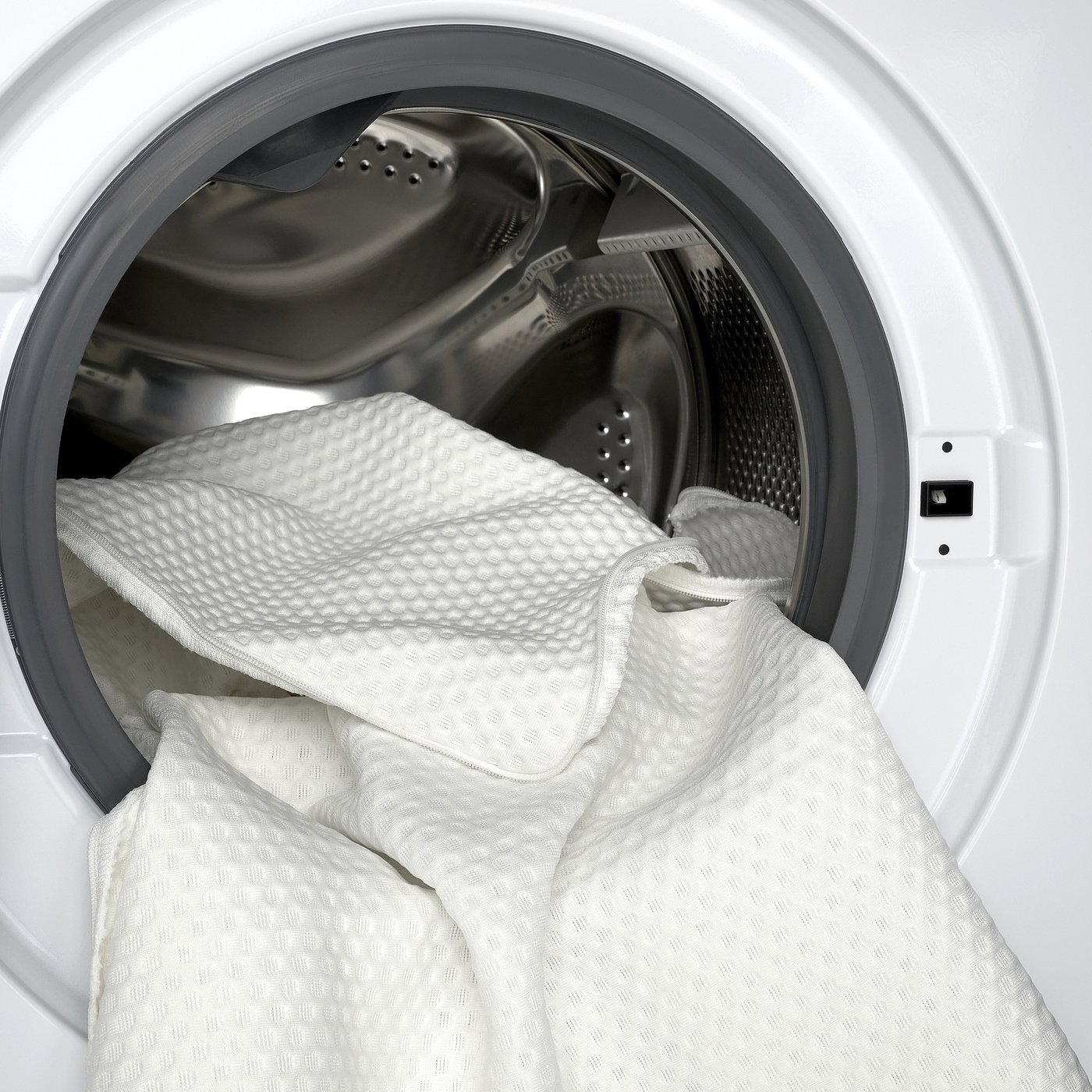 Washing machine with thick memory foam mattress pad. Easy-care, machine washable cover shown.