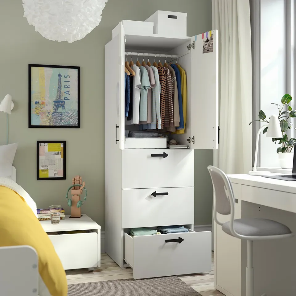 Wardrobe with hanging and drawer storage, open display of cloths.