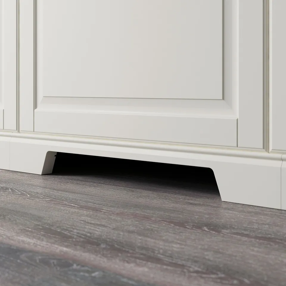 A modern kitchen plinth with a cut-out for ventilation, covering the gap between the floor and base cabinets.