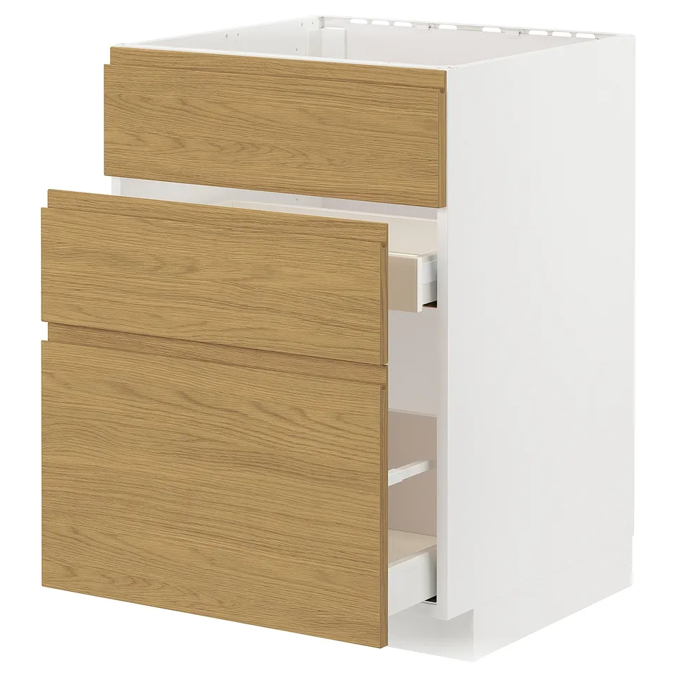 Wooden-style METOD kitchen unit. White box with light oak drawers, minimalist design, two large drawers, three small compartments.