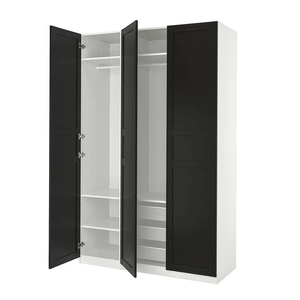 An open black and white ikea PAX wardrobe with shelves and a hanging rail. Its modern, rectangular, and has both drawers and hanging space.
