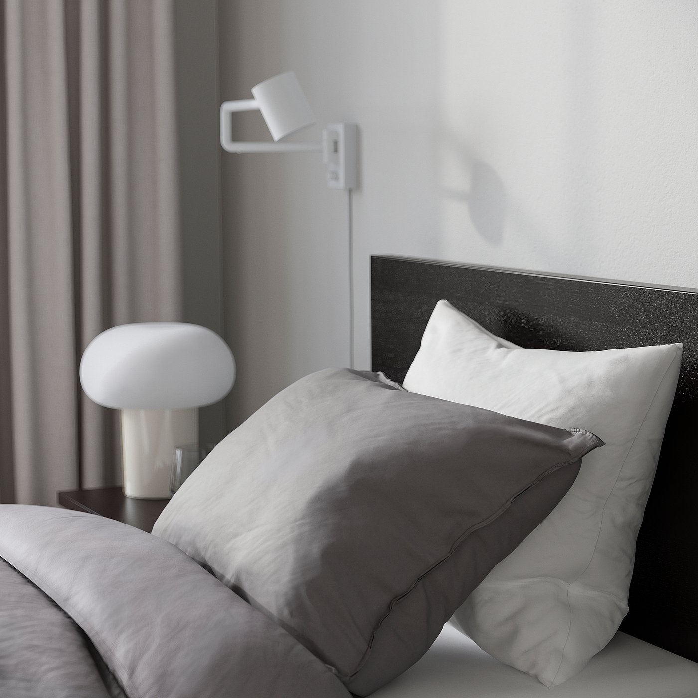 Modern bedroom with dark headboard bed, light bedding, bedside lamp, and wall reading light.