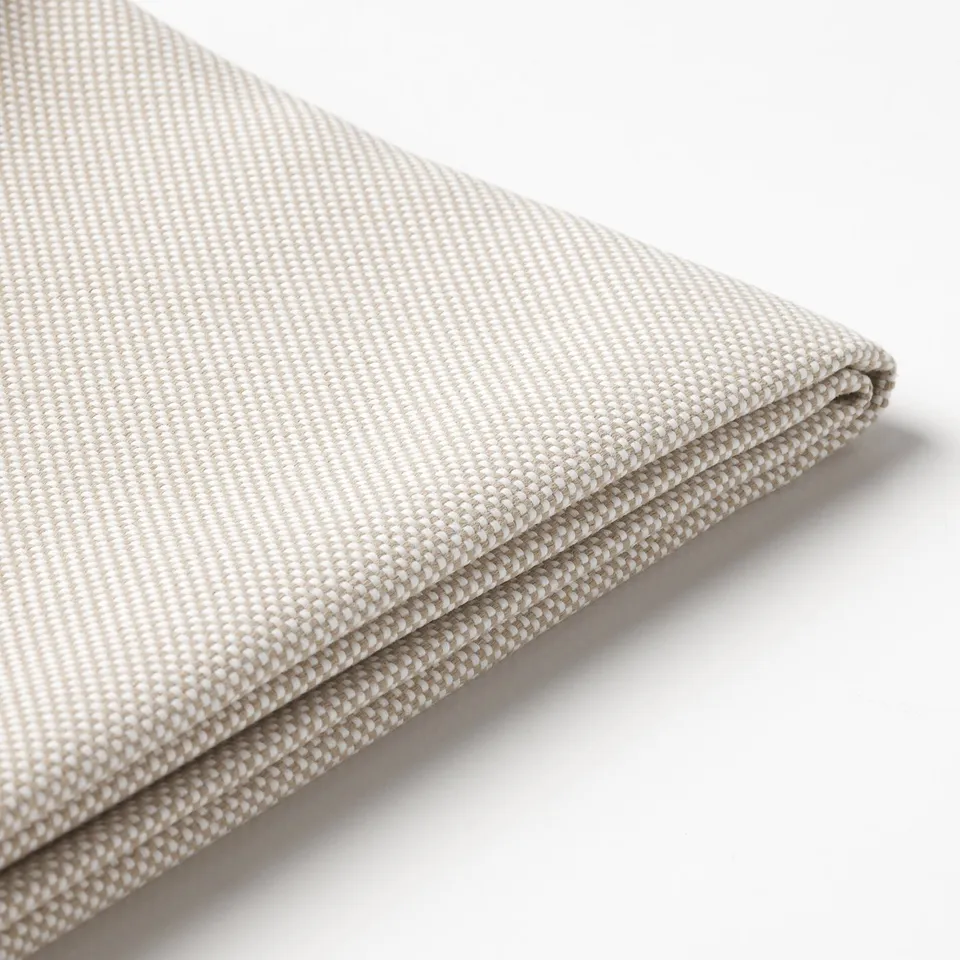 Close-up of folded beige cushion cover, smooth texture, quality fabric